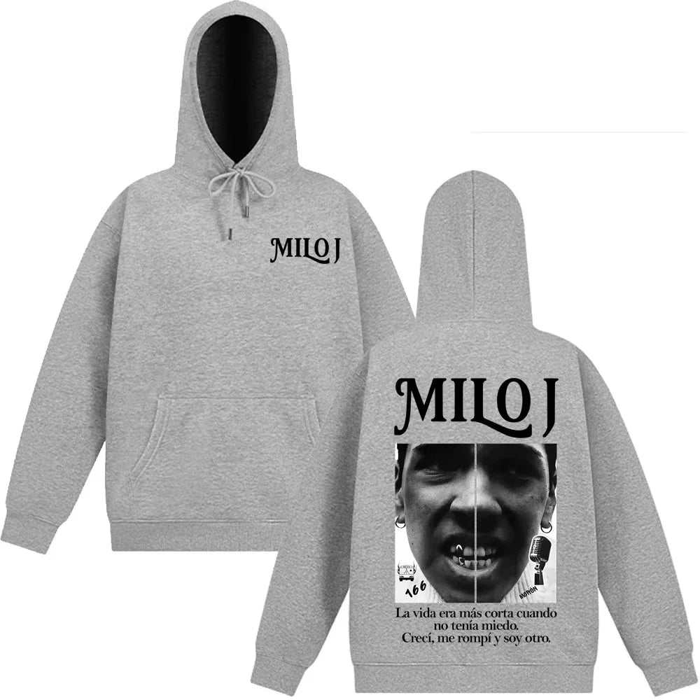 Back view of gray heathered milo j vintage graphic hoodie with black branding and split-face design for casual harajuku high wear