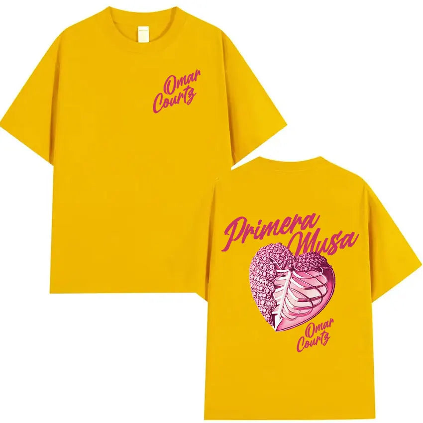 Bright yellow oversized tshirt featuring a pink heart graphic and text primera musa by rapper Omar Courtz streetwear