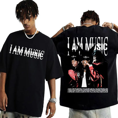 Black oversized cotton t shirt with bold white i am music text and rapper playboi carti graphic on back hip hop 90s vintage tshirt