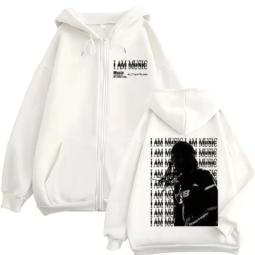White zip-up hoodie with black i am music graphic and microphone silhouette for hip hop pullovers by rapper playboi carti opium ken carson