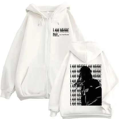 White zip-up hoodie with black i am music graphic and microphone silhouette for hip hop pullovers by rapper playboi carti opium ken carson