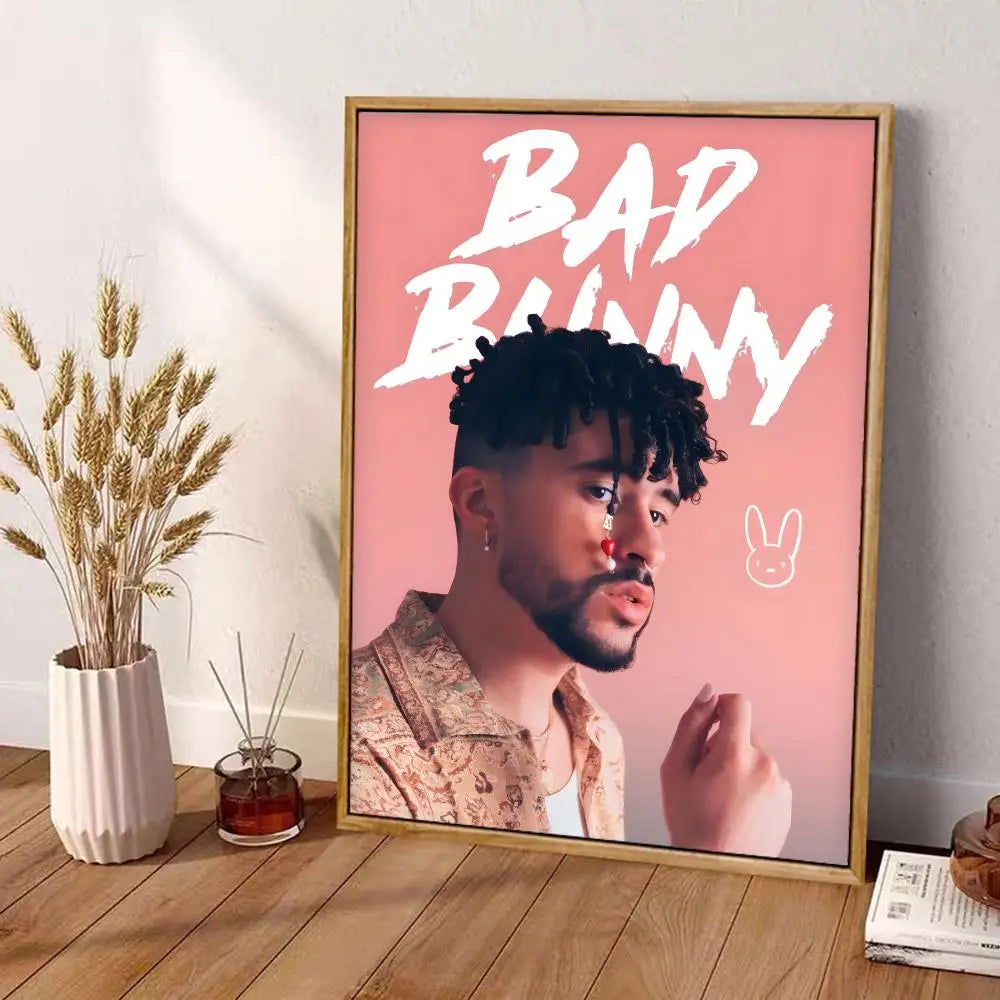 A framed bad bunny canvas poster with bold white text on pink background wall art decor in a light wood frame