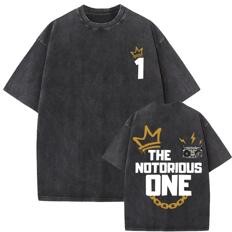 Back of black oversized biggie smalls tshirt with faded denim texture and bold white and gold dangerous vintage washed graphic print