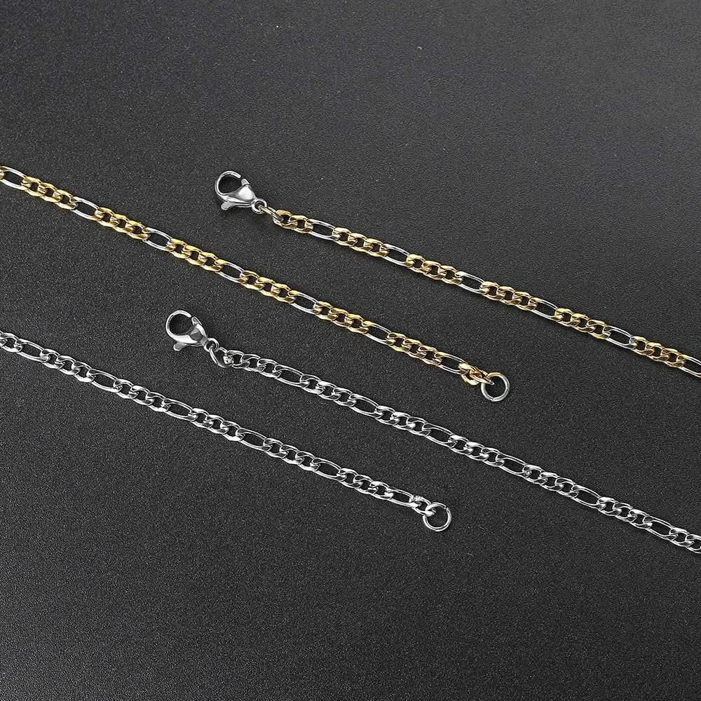 Two stainless steel hip hop figaro chains with lobster clasps in solid silver and two-tone gold silver finish