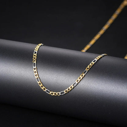 A two-tone gold and silver 3mm stainless steel hip hop figaro chain necklace with sleek interlocking links for men and women