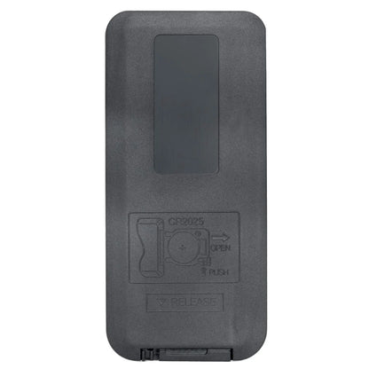 Black plastic battery compartment cover with embossed cr2032 insertion instructions on back of jbl home cinema soundbar remote control
