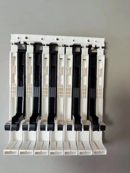 White and black plastic cable management clips with grid pattern for replacement digital piano repair yamaha p45 p48 keys