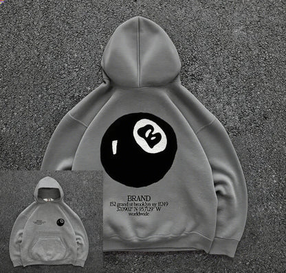 Back view of gray pullover casual hoodie with large black and white retro 8-ball pattern for hooded men’s streetwear