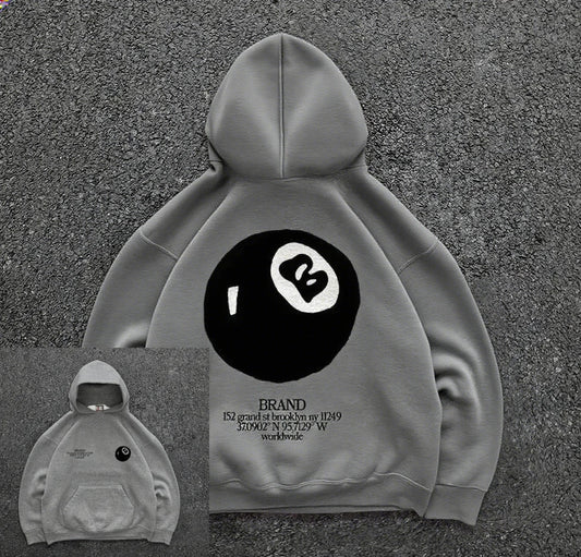 Back view of gray pullover casual hoodie with large black and white retro 8-ball pattern for hooded men’s streetwear