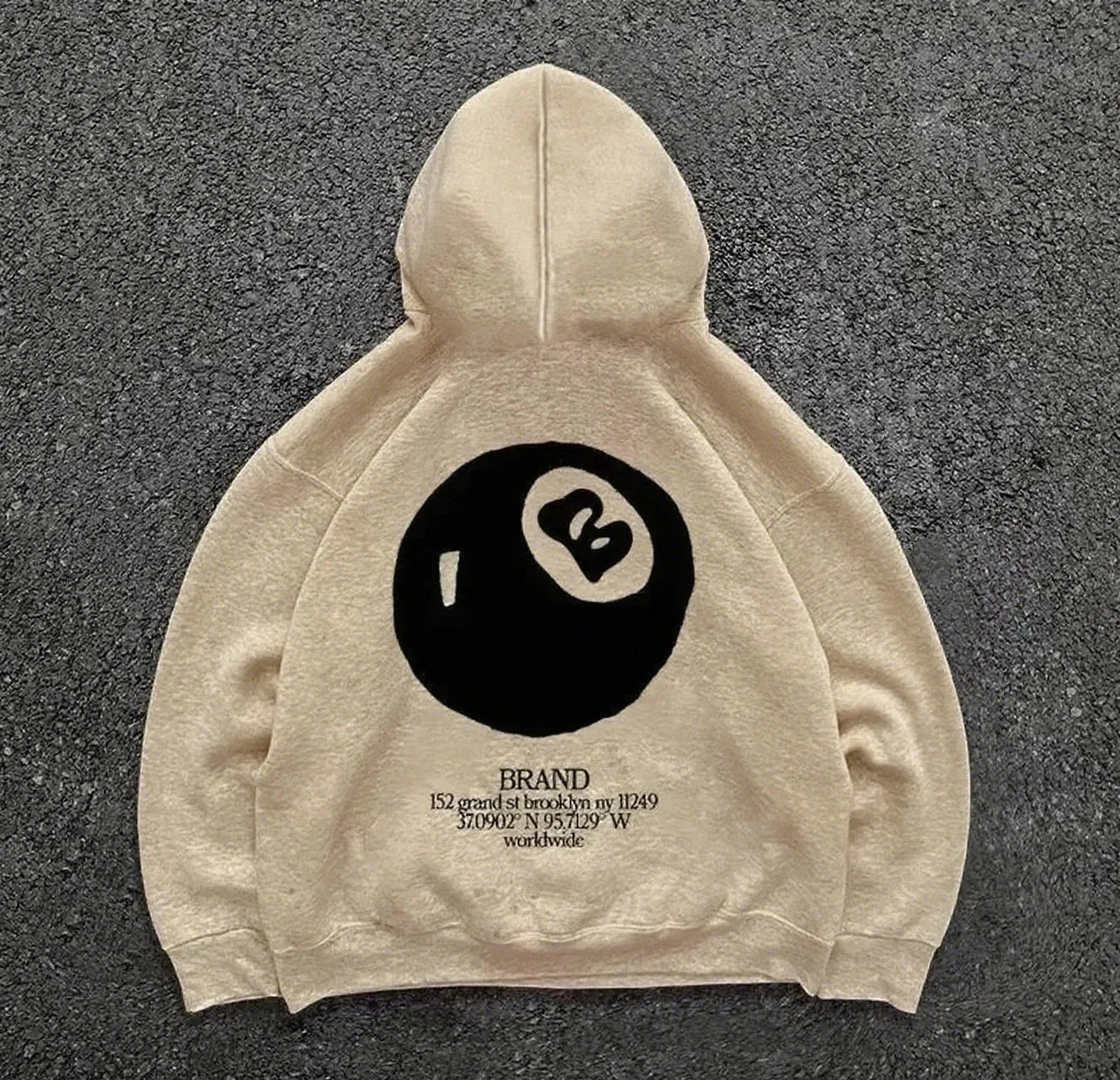 Beige hoodie back featuring bold black retro 8-ball pattern for hooded men’s streetwear oversized pullover casual style