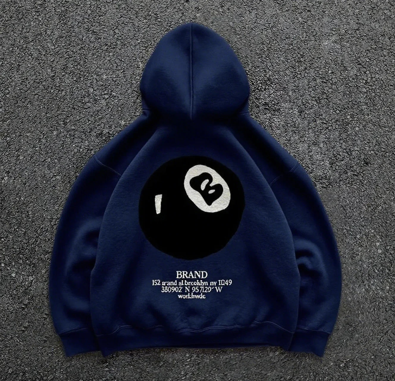 Back view of navy blue hooded men’s streetwear pullover featuring retro 8-ball pattern and casual oversized design