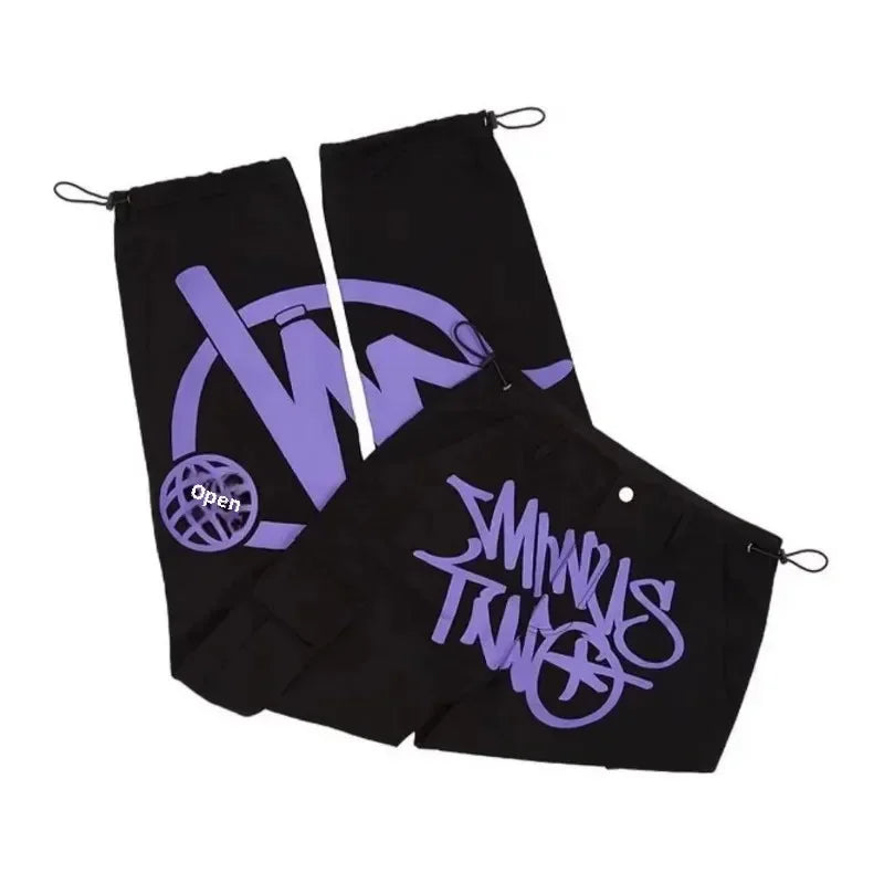 Black fabric drawstring pouches with purple graffiti logos and globe emblem for men dance scene loose workwear trousers