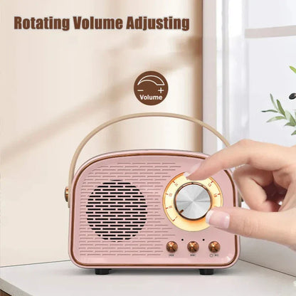 Pink retro-style bluetooth-compatible speaker with gold-tone volume dial and carrying handle for tws music player hifi use