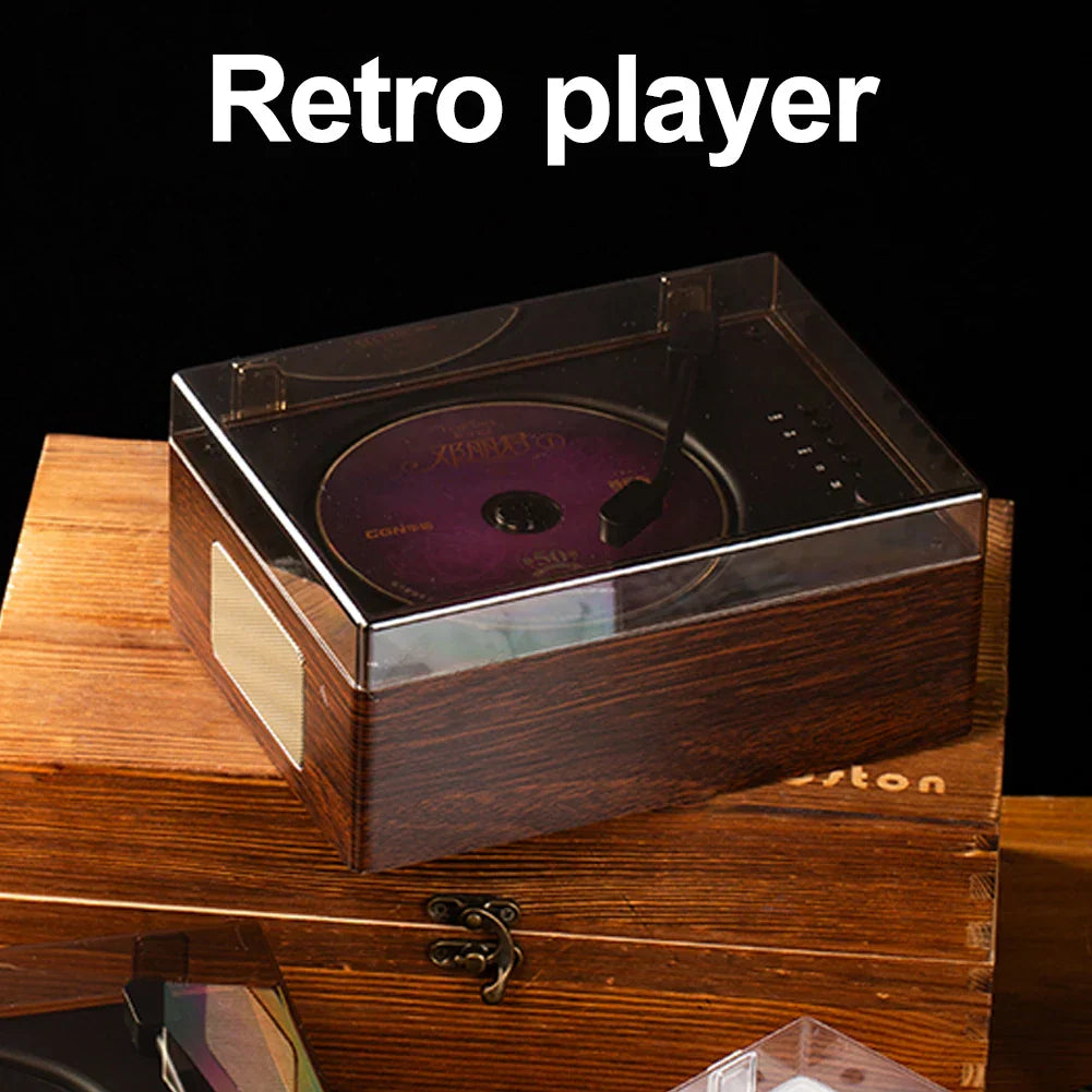 Dark wood-finish retro cd player with transparent acrylic lid and purple cd featuring rechargeable wireless bluetooth