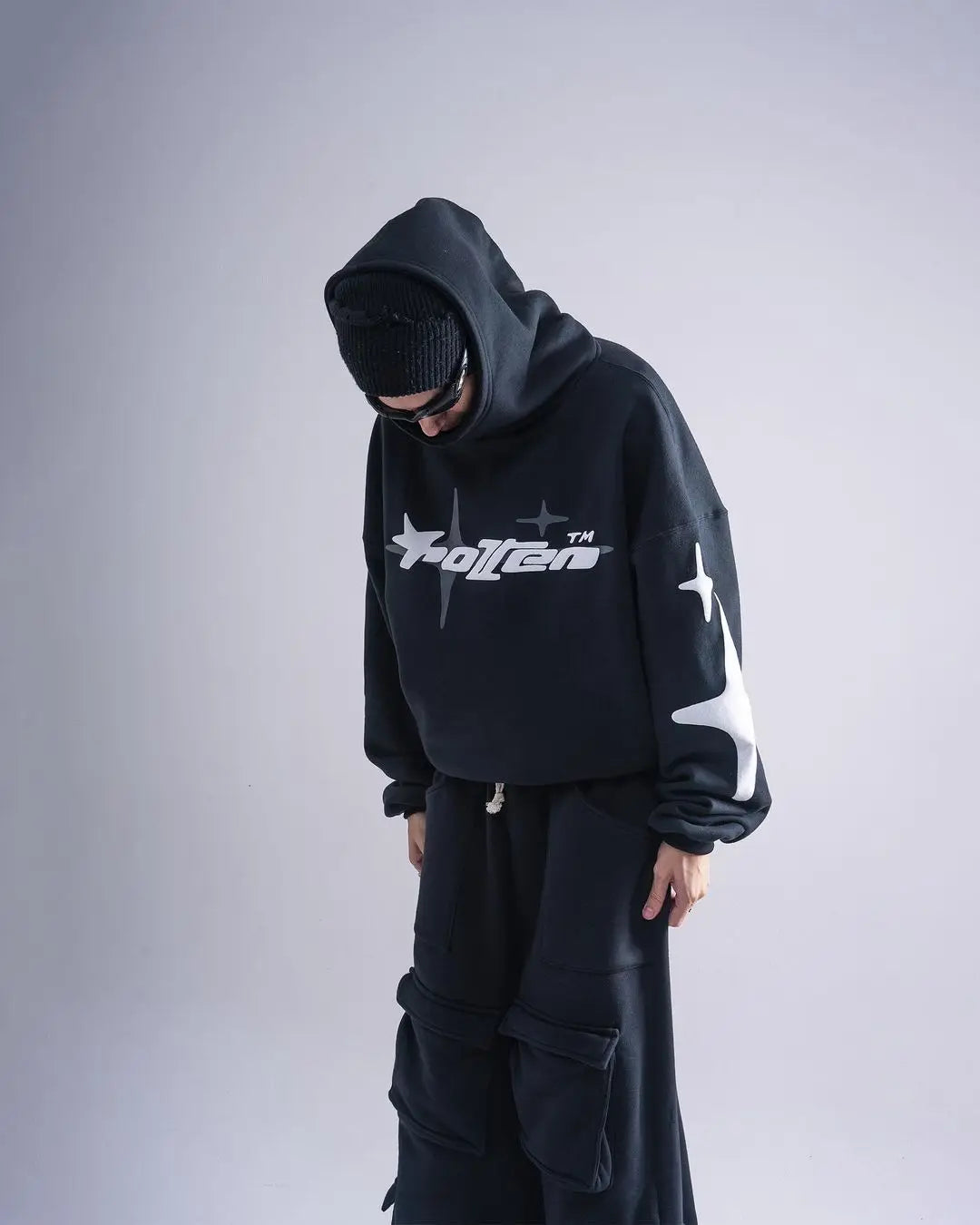 Black hoodie with white star and folten logo on front and sleeve designed for retro gothic men and harajuku men loose style