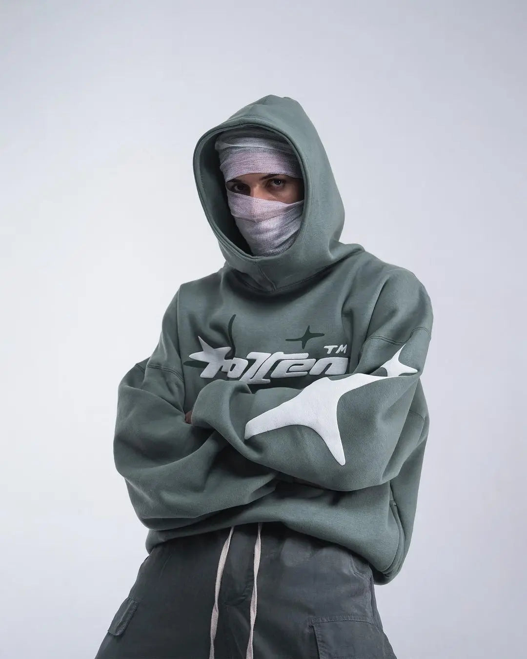 Olive green oversized hoodie with white star and totten logo graphic for retro gothic men street trendy2k harajuku style