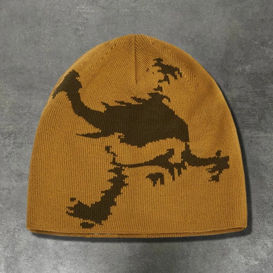 A mustard-yellow knitted embroidered hat trendy with a dark brown pixelated dragon design for fashion streetwear y2k