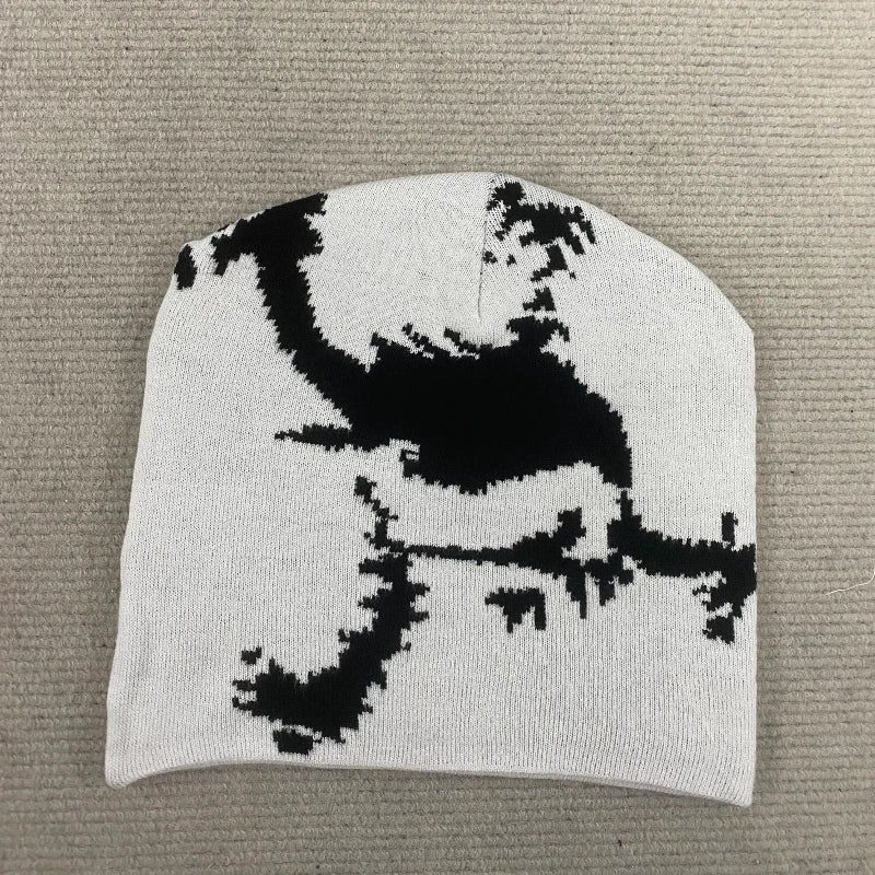 A white knit embroidered hat trendy featuring a bold black pixelated dinosaur design for fashion streetwear y2k style