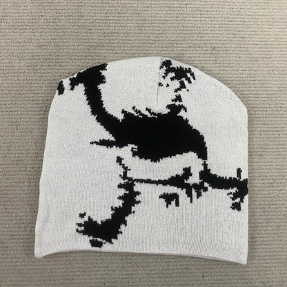 A white knit embroidered hat trendy featuring a bold black pixelated dinosaur design for fashion streetwear y2k style