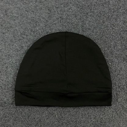 Black knit beanie with ribbed brim and seamless construction for trendy casual streetwear in retro hip-hop style