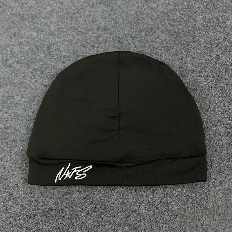 Black knit pullover hat trendy with white letter embroidery on folded brim casual versatile fashionable streetwear item