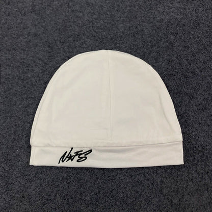 White knit beanie with black embroidered nats logo on the brim, retro hip-hop style pullover for streetwear fashion