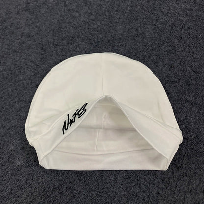 White swim cap with black embroidered nats logo featuring retro hip-hop letter design for trendy casual streetwear