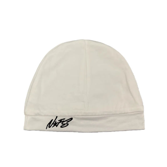 Cream-colored knit beanie with black embroidered nats logo on brim, a trendy casual pullover hat for streetwear