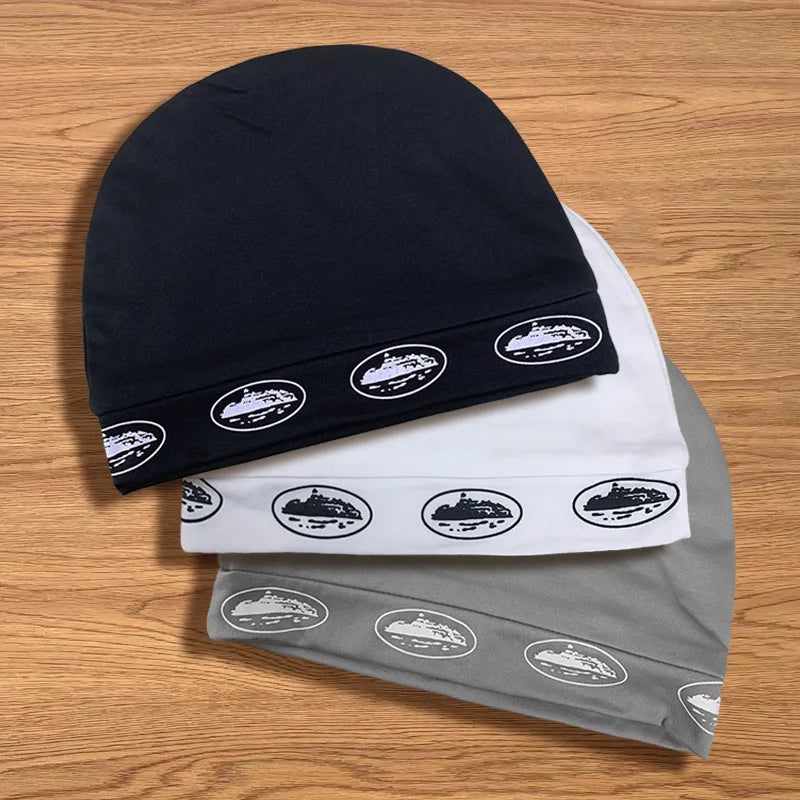 Three soft knit retro hip hop double-layer letter print caps in navy blue white and gray with ship oval logos