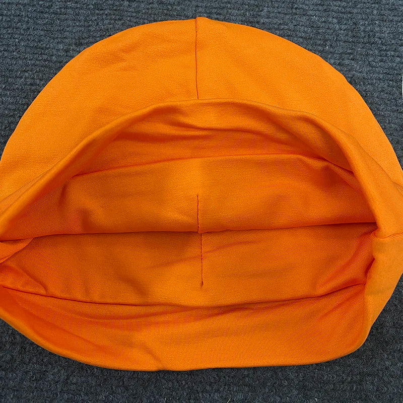 Bright orange knit pullover hat trendy with soft stretchy fabric and visible seam lines for cap fashionable streetwear