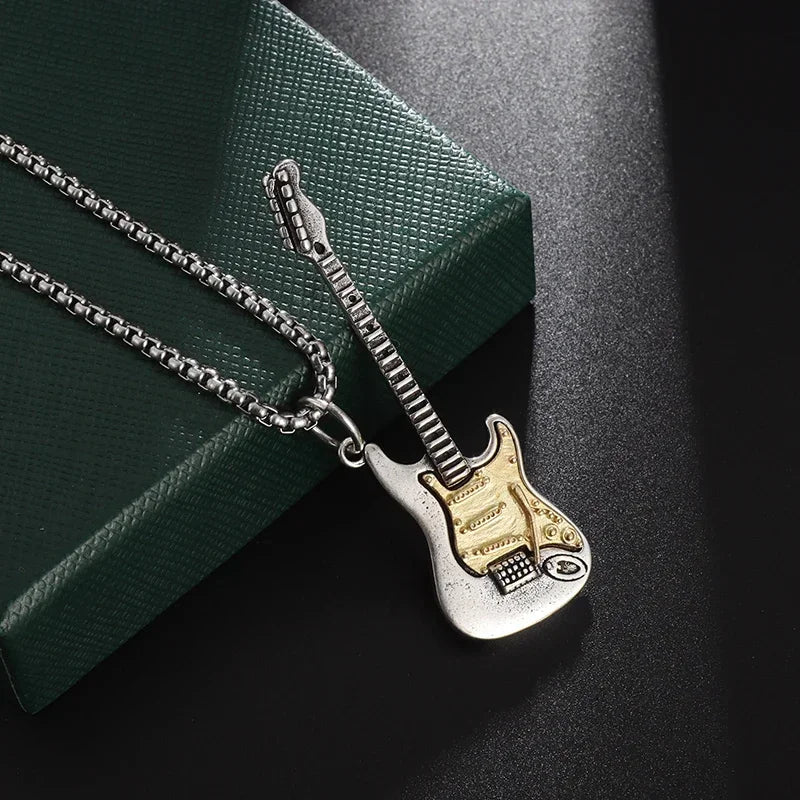 A two-tone silver and gold electric guitar necklace pendant with detailed fretboard as personalized gothic pendant for retro punk music fans