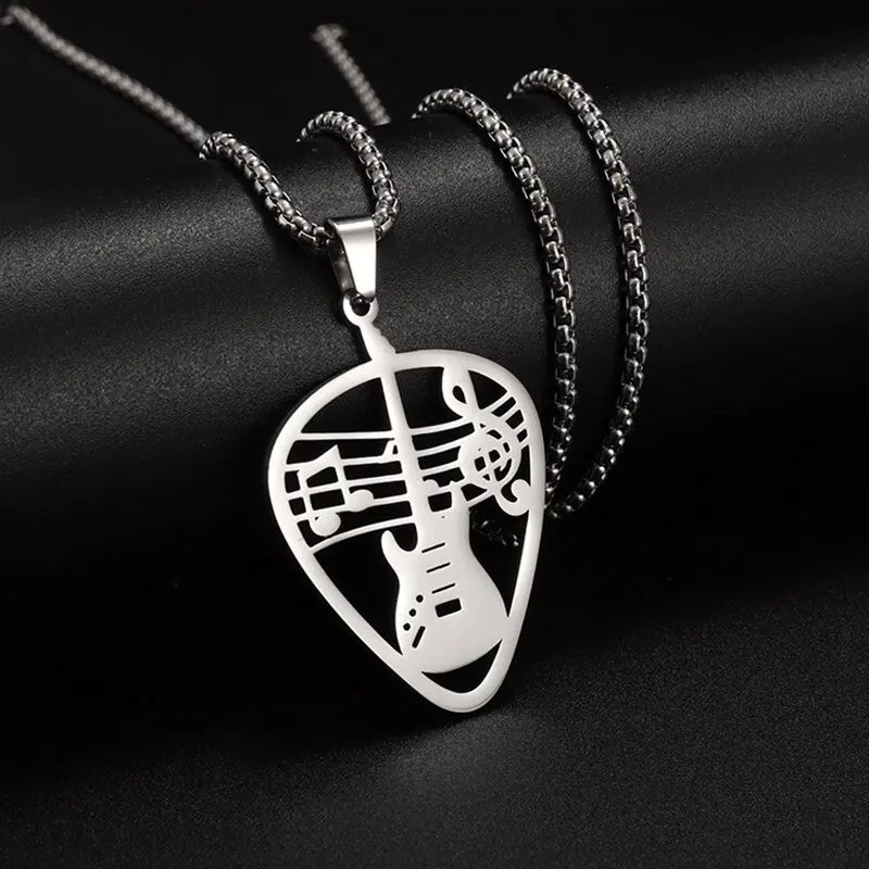 Silver guitar pick-shaped pendant necklace with intricate cut-out design featuring musical notes for retro punk music gifts
