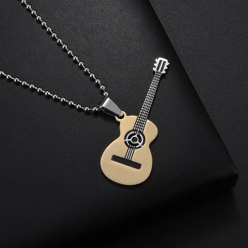 A sleek stainless steel rock singer jewelry guitar necklace with gold-tone body and black fretboard details on ball chain