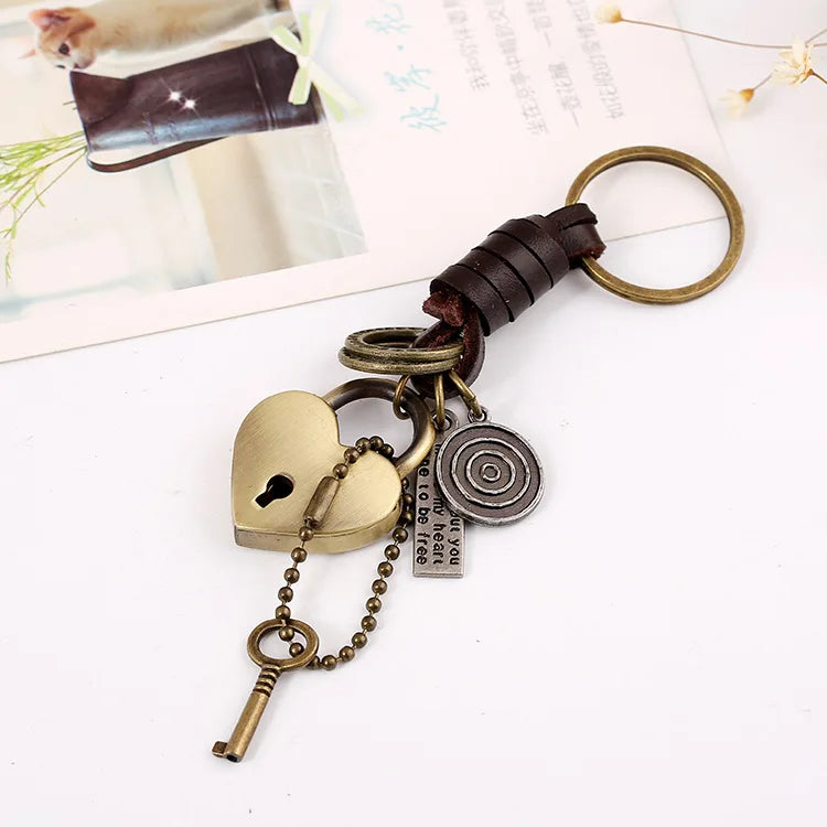 Antique brass heart-shaped lock pendant key with brown leather car key strap and vintage metal charms retro punk style