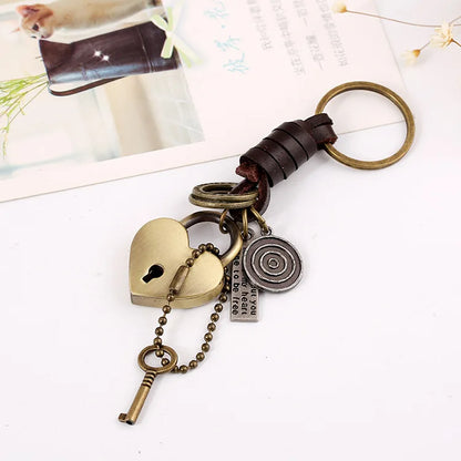 Antique brass heart-shaped lock pendant key with brown leather car key strap and vintage metal charms retro punk style