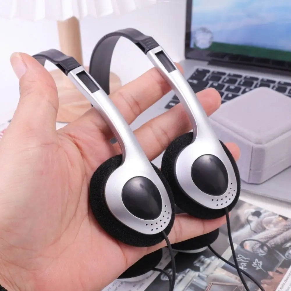 Silver and black retro wired headphones with padded earcups and adjustable headband for hip hop trends and walkman earphone personality