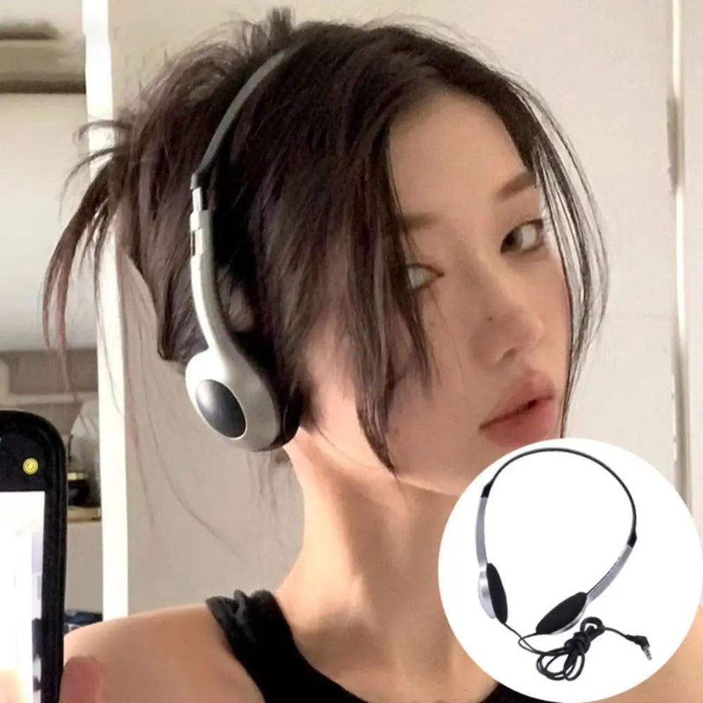 Silver and black retro wired headphones with sleek minimalist design featuring walkman earphone personality for hip hop trends