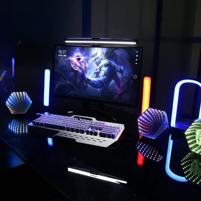 White mechanical gaming keyboard with rgb backlighting and sleek angular design beside rgb 3d hexagonal mirror tunnel desktop ambient lamp