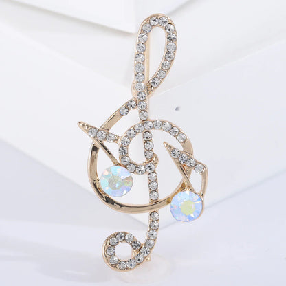 Gold-tone shiny glass musical treble clef brooch with clear rhinestones for event party backpack decoration