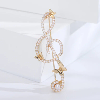 Gold-tone rhinestone butterfly pin featuring shiny glass musical note with pearls for event party backpack decoration