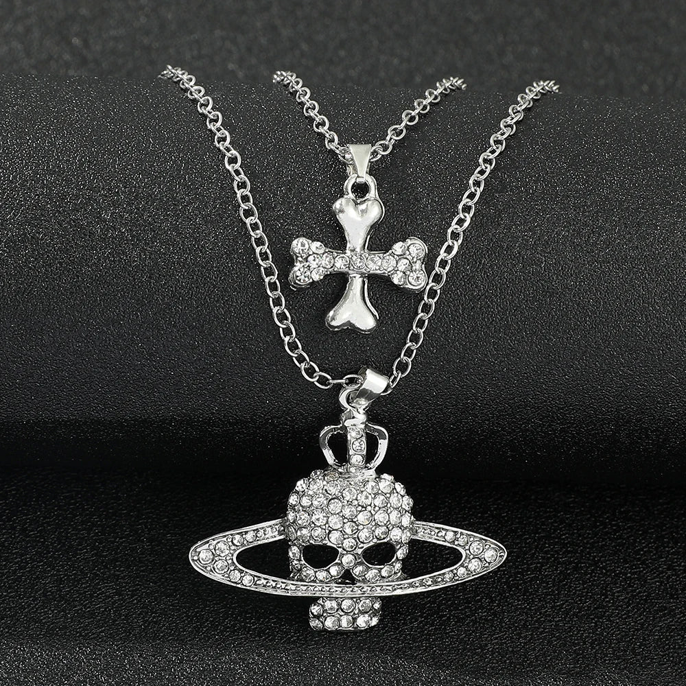 Silver-plated chain necklace vintage with rhinestone skull pendant featuring rings and crown in punk goth style