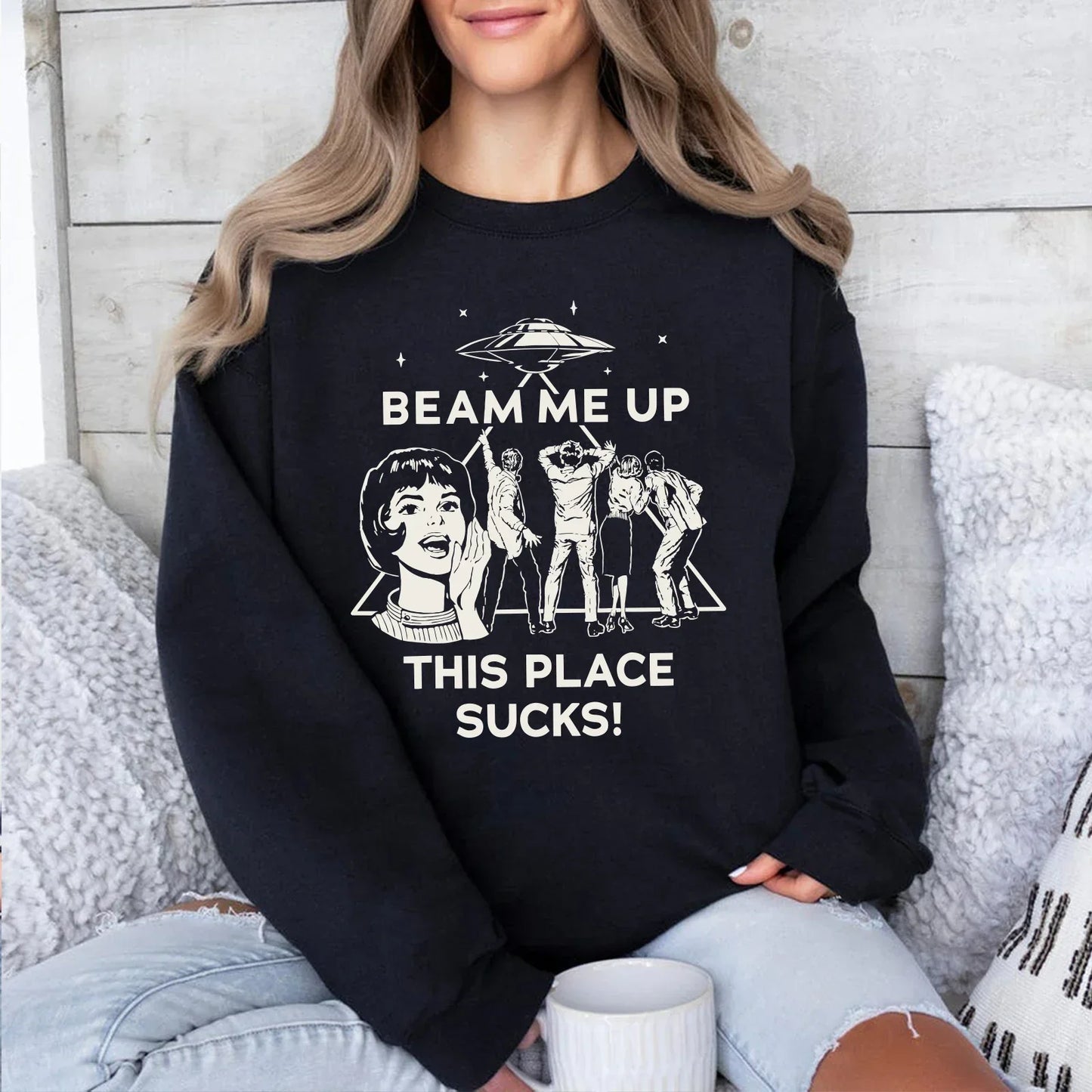 Black long-sleeved robin beam me up this place sucks sweatshirt with white ufo graphic and star trek characters man funny quote