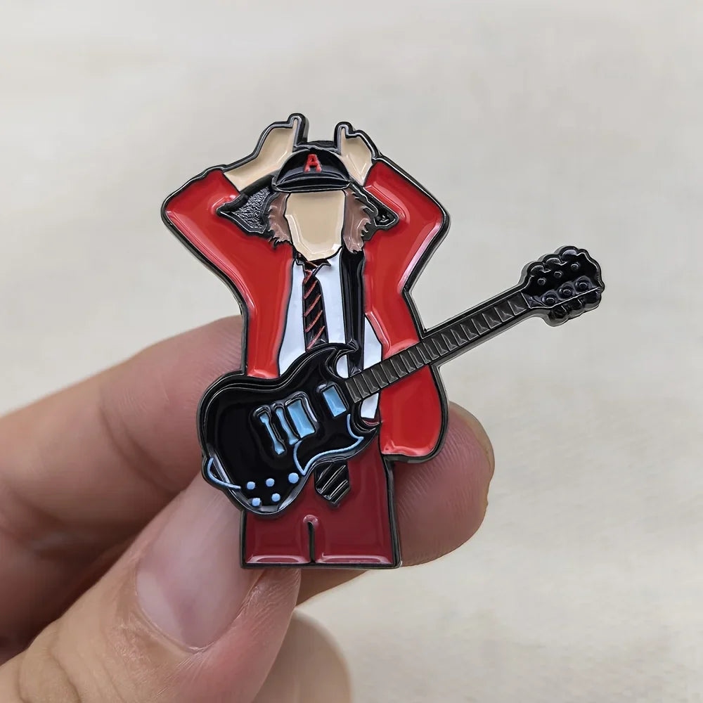 Red and black enamel pin featuring a stylized guitarist in a red jacket holding a black electric guitar for music fans