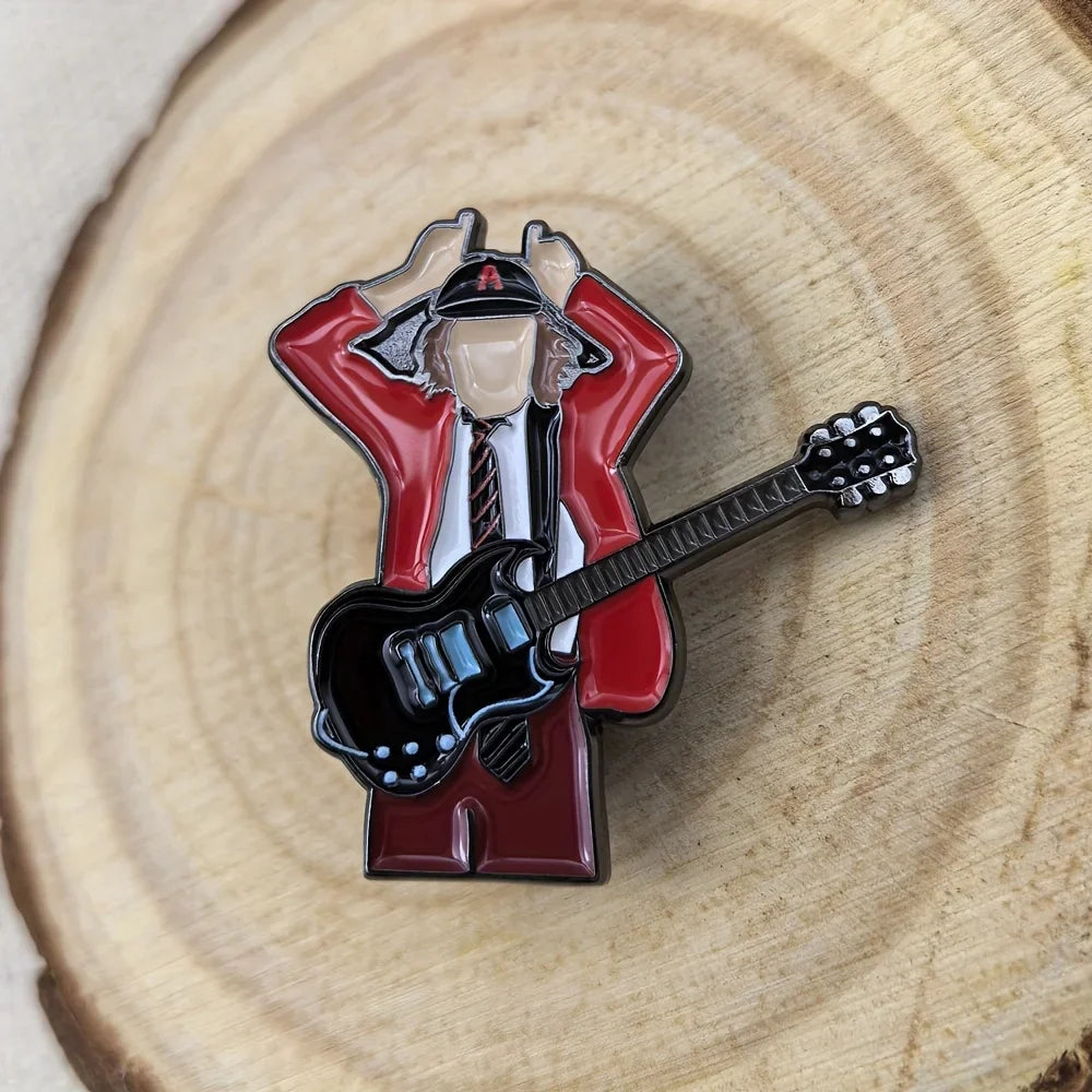 Red and black enamel pin featuring a stylized guitarist in a red jacket holding an electric guitar for music fans