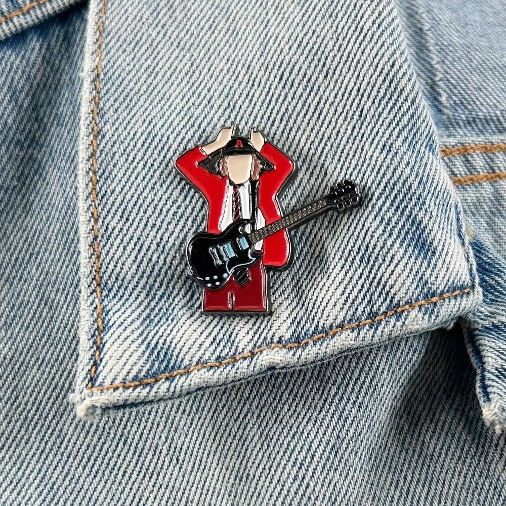Red enamel pin music featuring stylized badge guitarist angus young in red jacket holding black electric guitar for fans gift