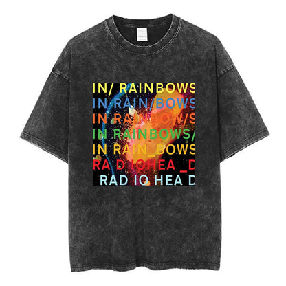 Black distressed cotton music short sleeve t-shirt featuring vibrant rainbow in rainbows graphic and radiohead band name
