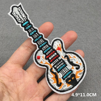 A colorful embroidered punk patch featuring teal red and orange flame guitar stripes iron on patch for clothing diy appliques