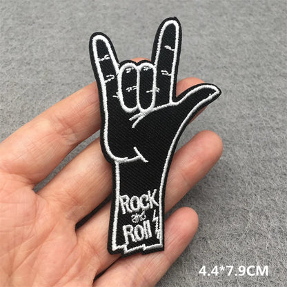 Black embroidered punk patch with white rock and roll hand sign and text for clothing diy appliques and guitar stripes iron
