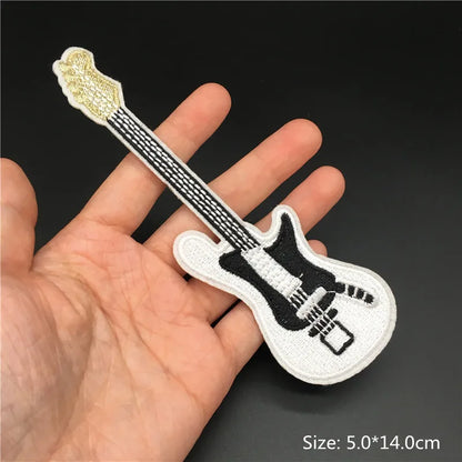 White embroidered electric guitar patch with black detailing and gold headstock for clothing diy appliques and guitar stripes iron