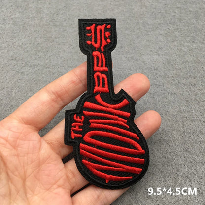 Black and red embroidered punk patch shaped like a guitar with the monkees for clothing diy appliques and guitar stripes iron